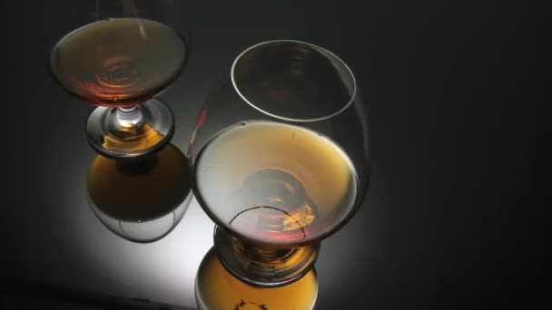 Two glasses of cognac — Stock Video