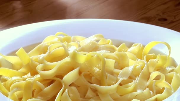 Serving ribbon pasta with sauce — Stock Video