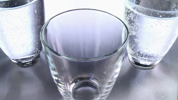 Pouring water into a glass — Stock Video