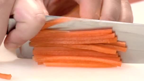 Cutting a carrot into sticks — Stock Video