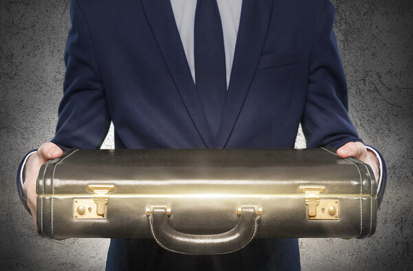 Worker with closed suitcase