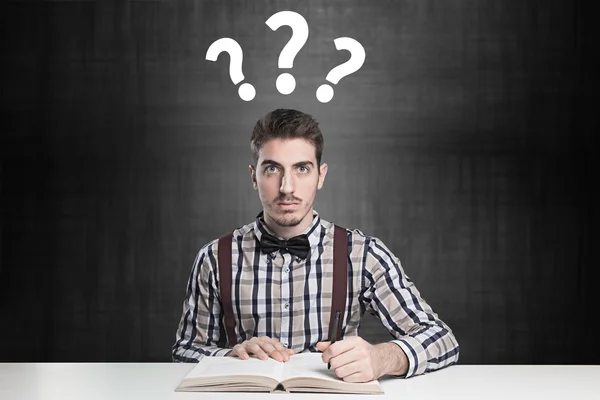 Genius confused with many questions over his head — Stock Photo, Image