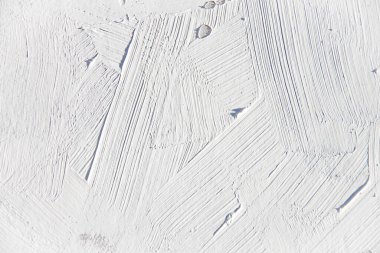 İlginç ve modern arka planlar için fırça ve palet bıçak darbeleriyle boyanmış beyaz doku. Web tasarımları ve duvar kağıtları için uygun.