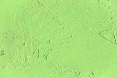 Yakın plan boyama. Açık yeşil renkli arka plan. Canlı, renkli, yaratıcı arkaplanlar için. Tuvaldeki yağ fırça darbelerinin dokusunu etkiler. Web ve tasarım için.