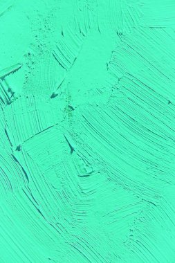 Yakın plan boyama. Açık yeşil renkli arka plan. Canlı, renkli, yaratıcı arkaplanlar için. Tuvaldeki yağ fırça darbelerinin dokusunu etkiler. Web ve tasarım için.