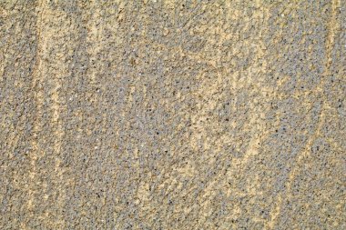 Çatlakları ve çizikleri olan beton bir duvarın dokusu arka plan olarak kullanılabilir.