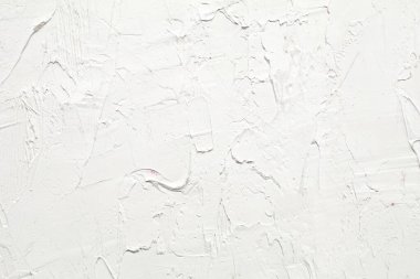 İlginç ve modern arka planlar için fırça darbeleri ve palet bıçaklı beyaz doku. Web tasarımı ve duvar kağıtları için uygun.