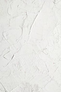 İlginç ve modern arka planlar için fırça darbeleri ve palet bıçaklı beyaz doku. Web tasarımı ve duvar kağıtları için uygun.