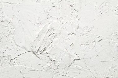 Beyaz yağlı boya boya çeşitli arkaplanlar için fırça darbeleri vuruyor.