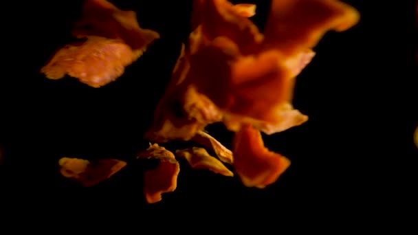 Pieces of Mango falling from top into a black background — Stock Video
