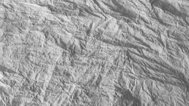 Moving crumbled up paper background fullscreen, stop-motion, slow version. — Stock Video
