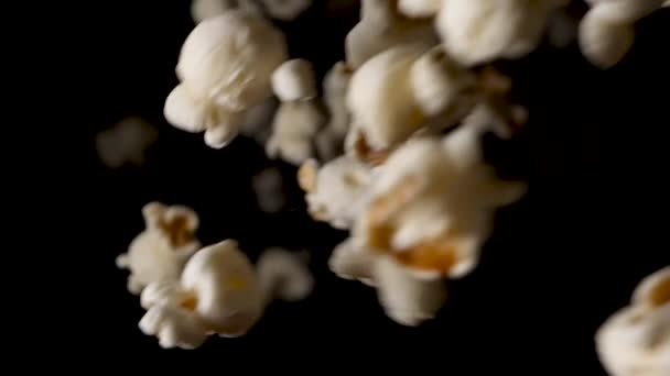 Popcorn empties out in the cinema on the floor, slow motion. — Stockvideo