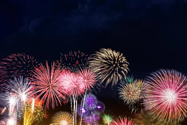 Colorful fireworks display background with copy space.