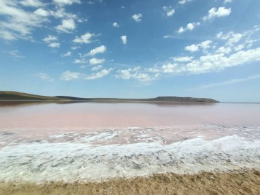 Beautiful salt pink or rose lake under blue sky