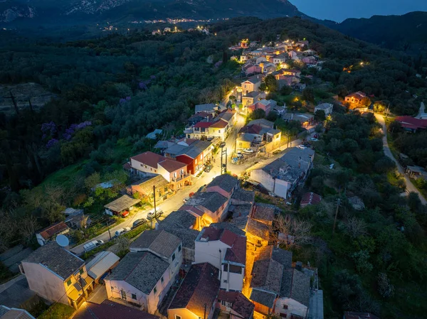 Illuminated hillside village of Zygos, Corfu at night