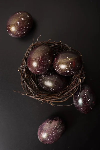 Black galaxy eggs at black background — Stock Photo, Image