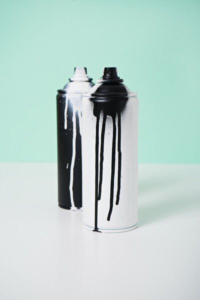 black and white spray paint bottle