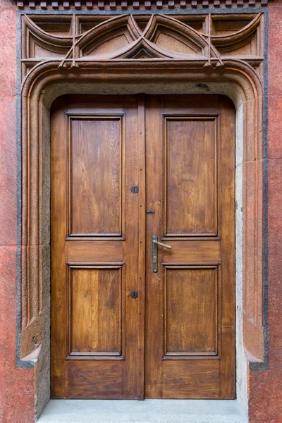 Portal with old refurbished doors — Stock Photo, Image
