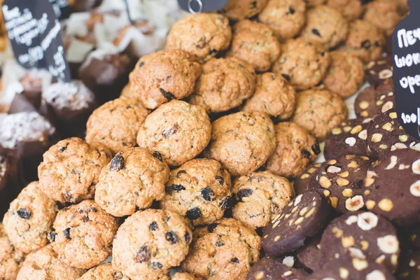 coffee and bakery shop bar with mix of tasty fresh baked chocolade oatmeal pastry with nuts