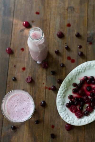 Fresh organic blackberry cherry smoothie made of homemade yogurt and berries from farmers market on dark wood rustic style background soft focus overhead-angle shot — Stock Photo, Image