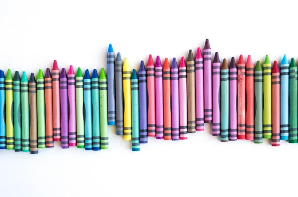 Crayons lined up isolated on white background — Stock Photo, Image