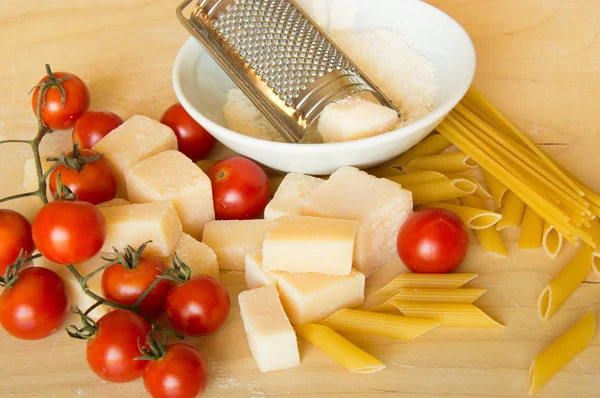 Grana padano  with pasta and tomatoes — Stock Photo, Image