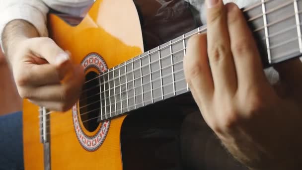 Hands playing on acoustic guitar in slow motion — Stock Video