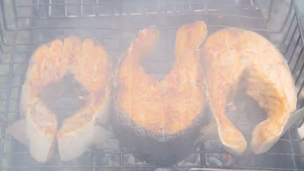 Fish fried on a grill — Stock Video