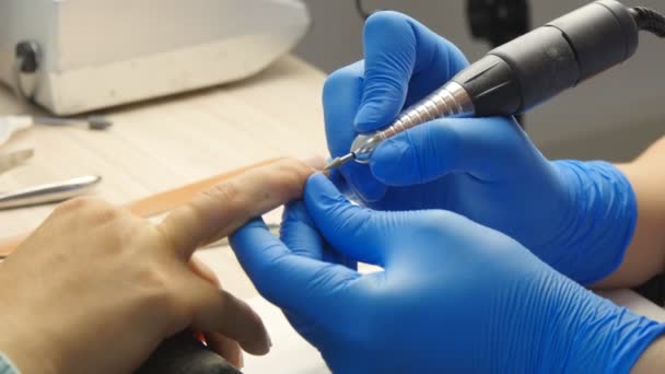 Manicure. The device removes the cuticle — Stock Video