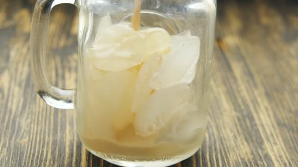 Pouring Ice coffee on a glass — Stock Video