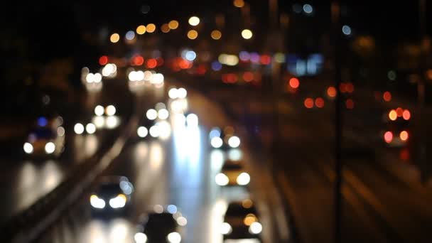 Defocused urban abstract texture ,blurred background with bokeh of city lights from car on street at night, vintage or retro color tone — Stock Video