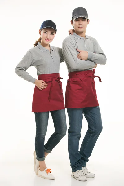 Wear all kinds of T-shirts waiter standing in white background — Stock Photo, Image