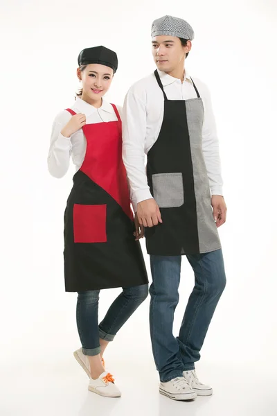 Wear all kinds of T-shirts waiter standing in white background — Stock Photo, Image