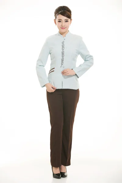 Beyaz bir arka plan önünde Stand tulum giymiş