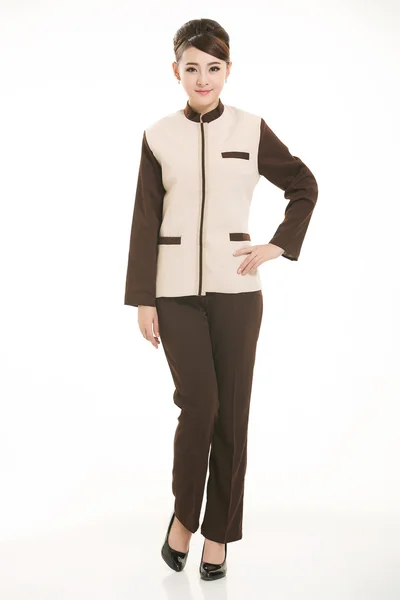 Beyaz bir arka plan önünde Stand tulum giymiş