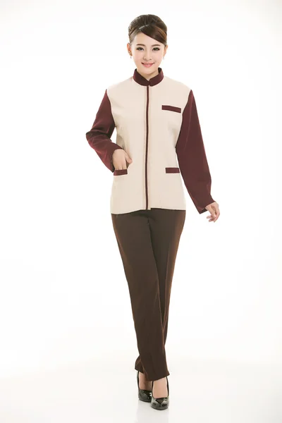 Beyaz bir arka plan önünde Stand tulum giymiş