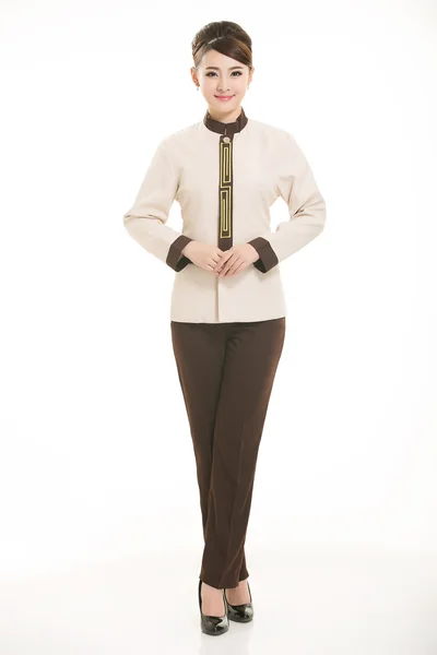 Beyaz bir arka plan önünde Stand tulum giymiş