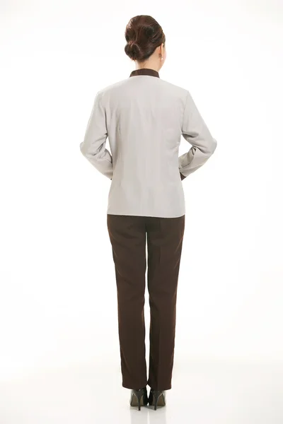 Vestita di salopette che stanno davanti a uno sfondo bianco — Foto Stock