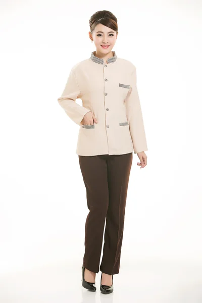 Beyaz bir arka plan önünde Stand tulum giymiş