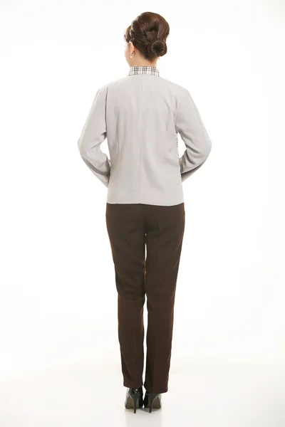 Klädd i overall som står framför en vit bakgrund — Stockfoto