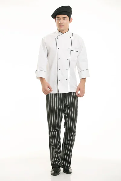 Vestindo todos os tipos de roupas chef nutricionista na frente de fundo branco — Fotografia de Stock