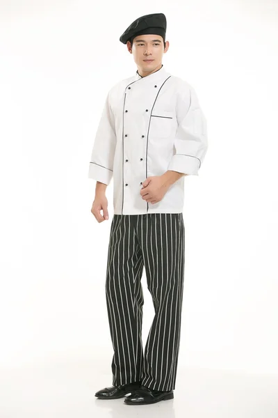 Vestindo todos os tipos de roupas chef nutricionista na frente de fundo branco — Fotografia de Stock