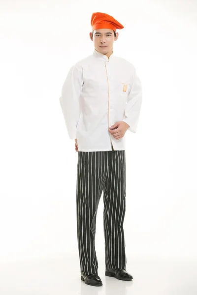 Носіння всілякого одягу шеф-кухаря дієтолога перед білим тлом — стокове фото