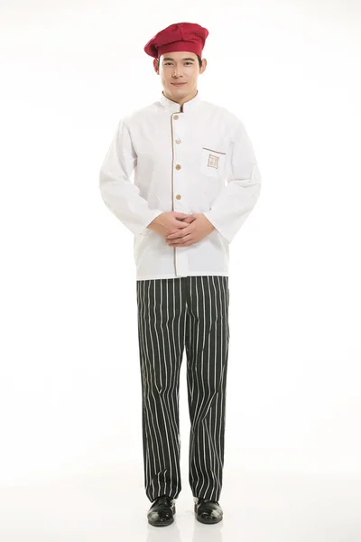 Носіння всілякого одягу шеф-кухаря дієтолога перед білим тлом — стокове фото