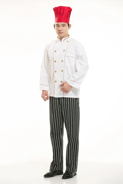 Vestindo todos os tipos de roupas chef nutricionista na frente de fundo branco — Fotografia de Stock