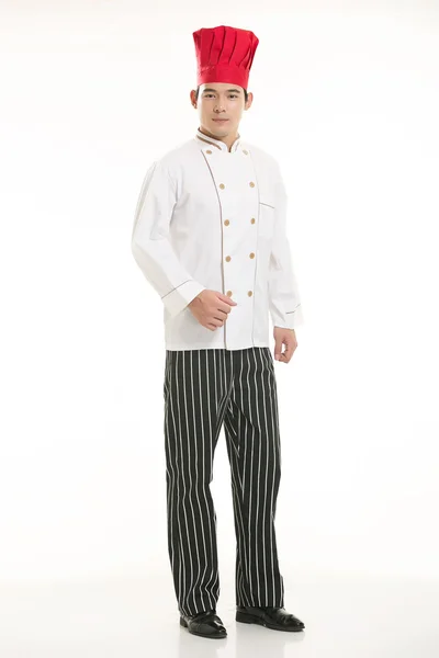 Het dragen van allerlei kleding chef-kok diëtist in de voorkant van witte achtergrond — Stockfoto