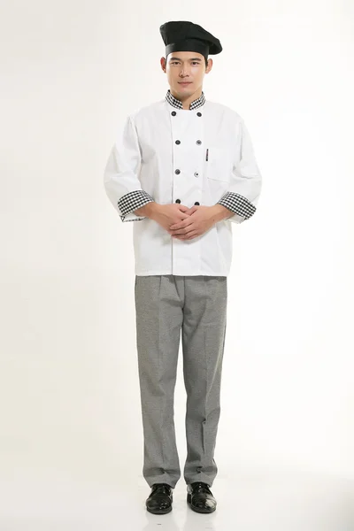 Vestindo todos os tipos de roupas chef nutricionista na frente de fundo branco — Fotografia de Stock