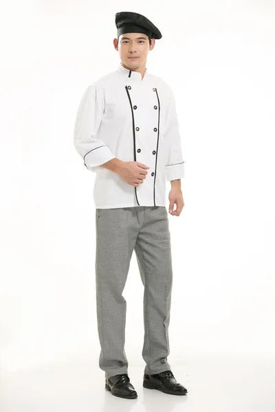 穿着各种服装的厨师在白种人的背景面前 — 图库照片