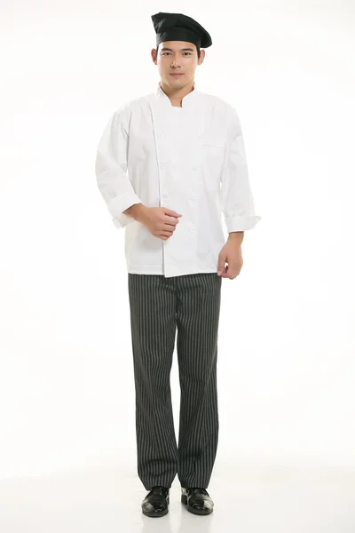 Vestindo todos os tipos de roupas chef nutricionista na frente de fundo branco — Fotografia de Stock