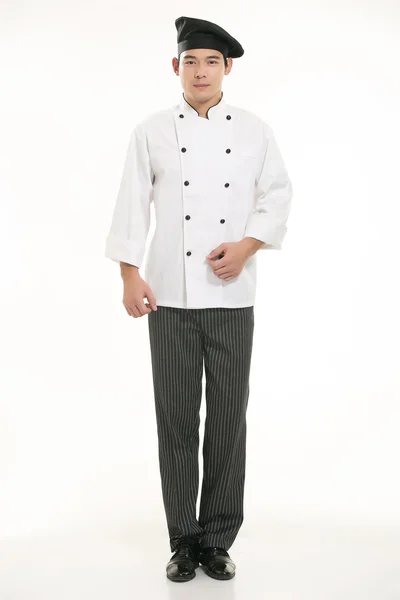 Vestindo todos os tipos de roupas chef nutricionista na frente de fundo branco — Fotografia de Stock